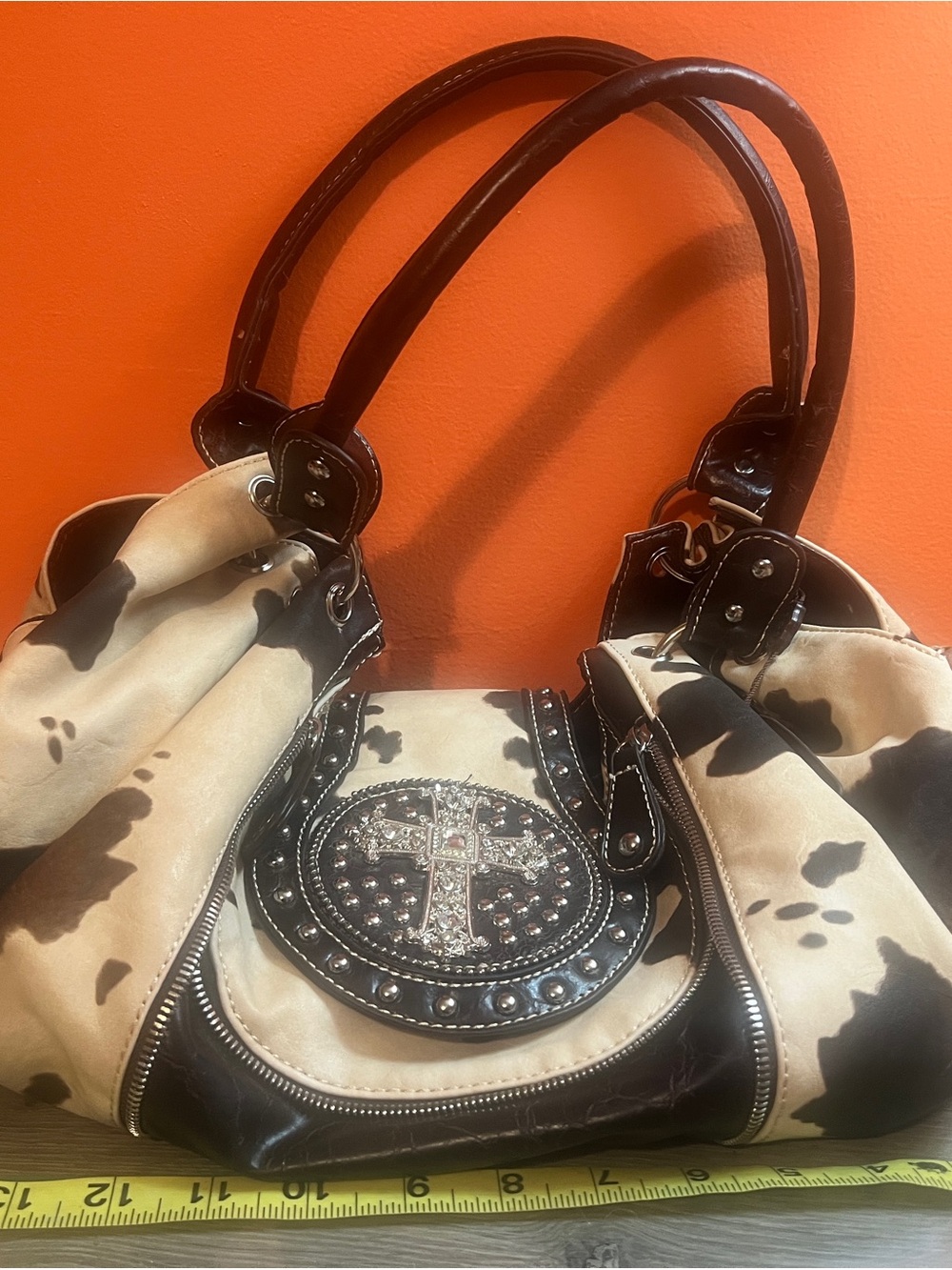 P&G Large Studded Cross Accent Cow Print Shoulder Bag